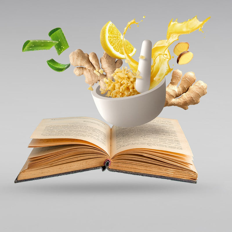A bowl with pieces of ginger, lemon and agave pops out of a book
