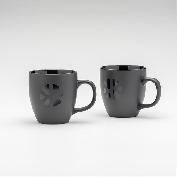 2 Kloster Kitchen mugs. The mugs are matt black and have the Kloster Kitchen logo in glossy black on the front.