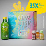 Kloster Kitchen Adventskalender mit 35 Bio-Ingwer-Shots, bunt gestaltete Kartonbox mit Türchen-Nummern, daneben eine grüne Flasche Ingwer Shot Classic (12 Shots, Bio-Siegel) und drei kleine Shot-Fläschchen.