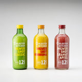 Inhalt der 12SHOTS Ingwer Shot Mix Box: Ingwer Shot Classic, Ingwer Shot Kurkuma und Ingwer Shot Granatapfel jeweils in der 360 ml Flasche nebeneinander