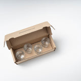 Glasses for ginger shots: The packaging of the shot glasses is open, you can look down on the 4 shot glasses from above.