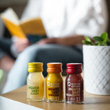 Contents of Ginger Shot Tasting Set S: Ginger Shot Classic, Ginger Shot Turmeric and Ginger Shot Pomegranate stand side by side.