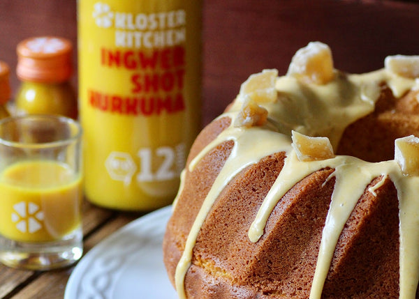 The finished ginger turmeric gugelhupf, decorated with glaze and candied ginger pieces