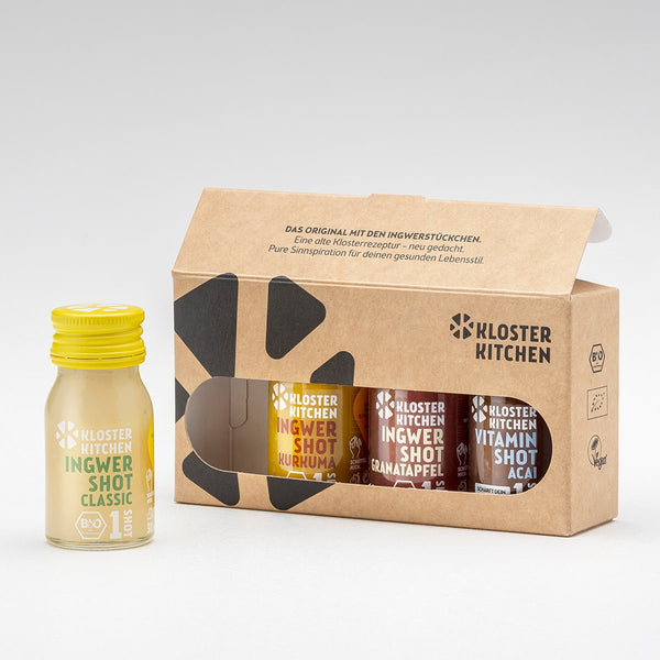 1SHOT 4er Mix Box: ein Ingwer Shot Classic 30 ml steht vor der Verpackung, die restlichen drei 30 ml Fläschchen sind noch in der Verpackung.