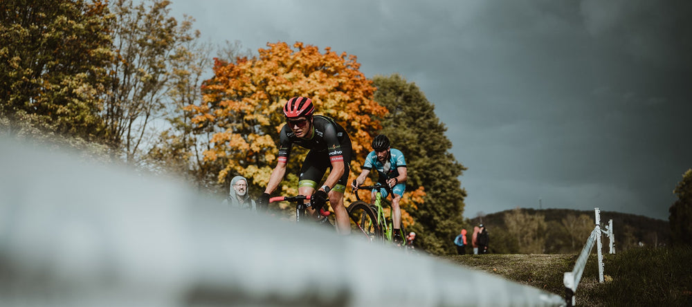 A cyclist on a race track, doing the best he can.
